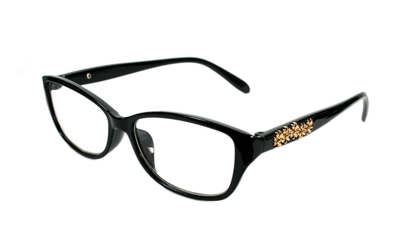 Sort brille med guldfarvet blomster pÃ¥ stang.