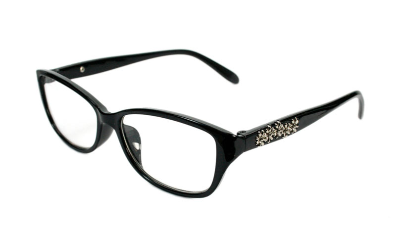 Sort brille med sÃ¸lvfarvet blomster pÃ¥ stang.